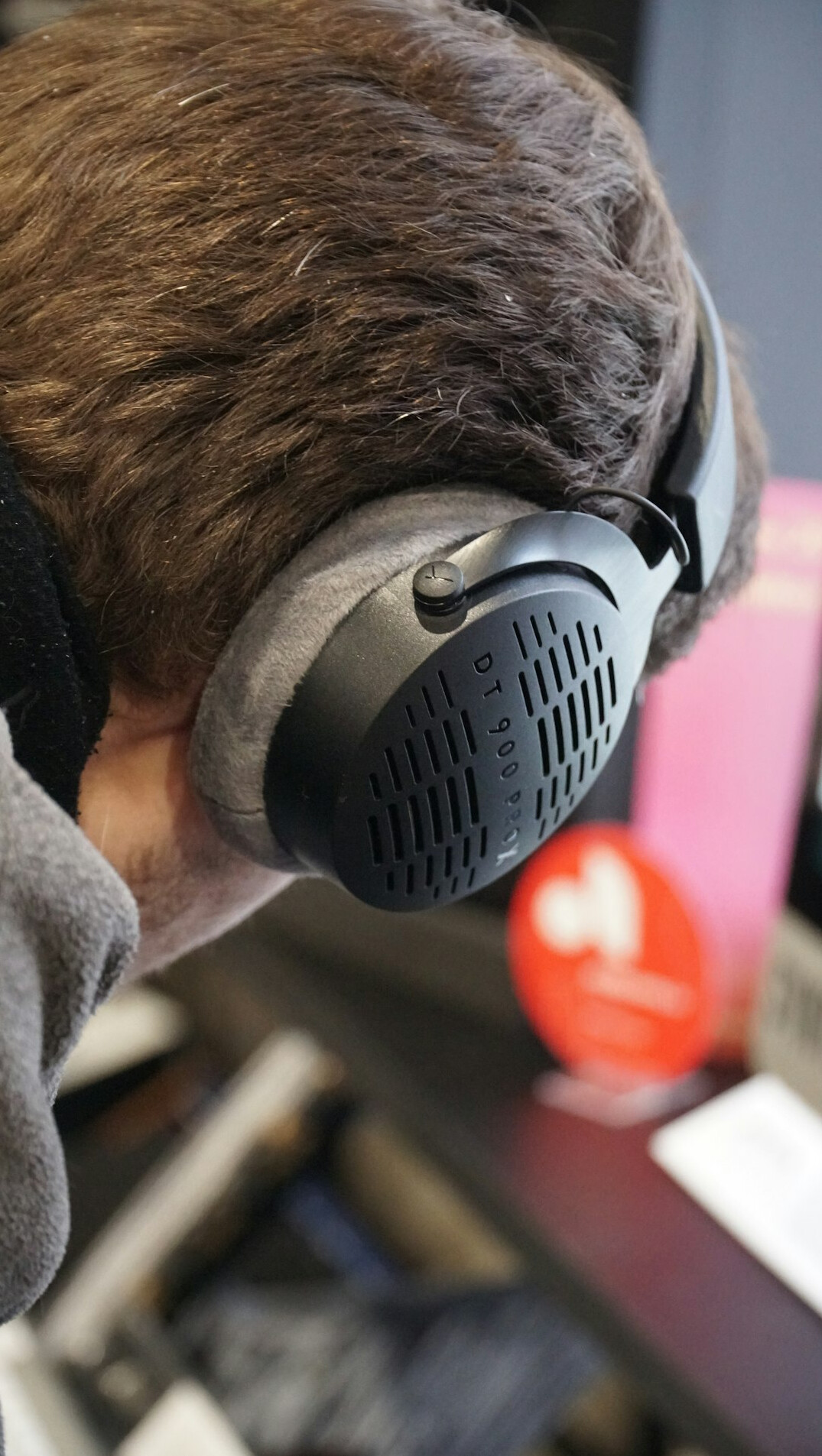 Person working with noise-cancelling headphones in deep concentration