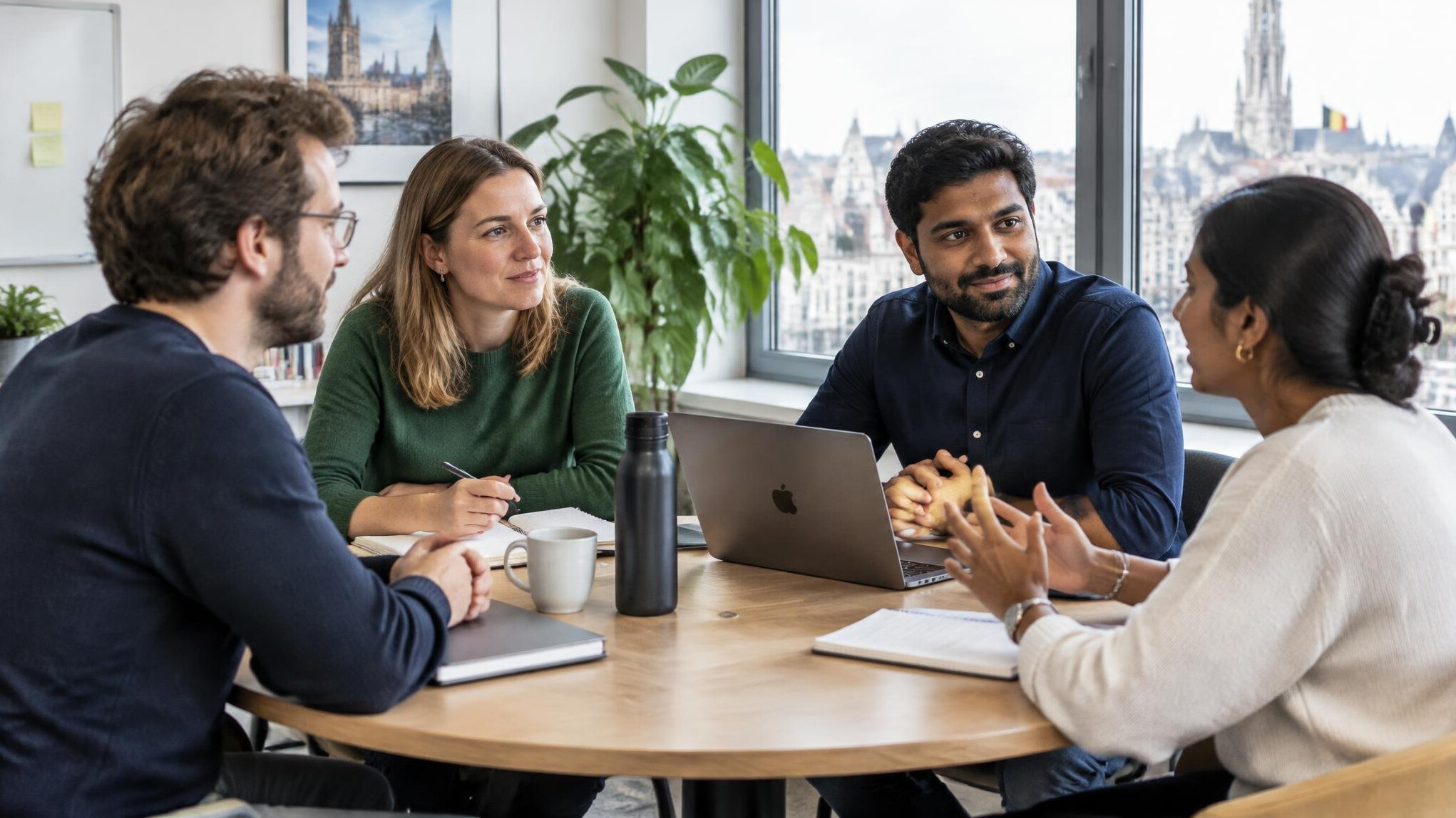 Group of colleagues having a calm discussion around a table