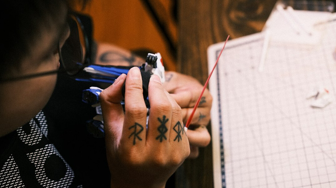 Close-up of hands writing notes during a workshop